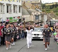 Who's that torch bearer? Bob Diamond? No it's that other fat cat Sir Martin Sorrell!